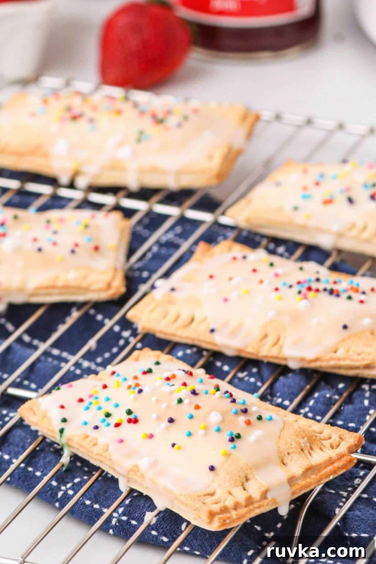 Air Fried Pop Tart Perfection 10 Close up photo of homemade pop tart with drizzle of frosting glaze and sprinkles.