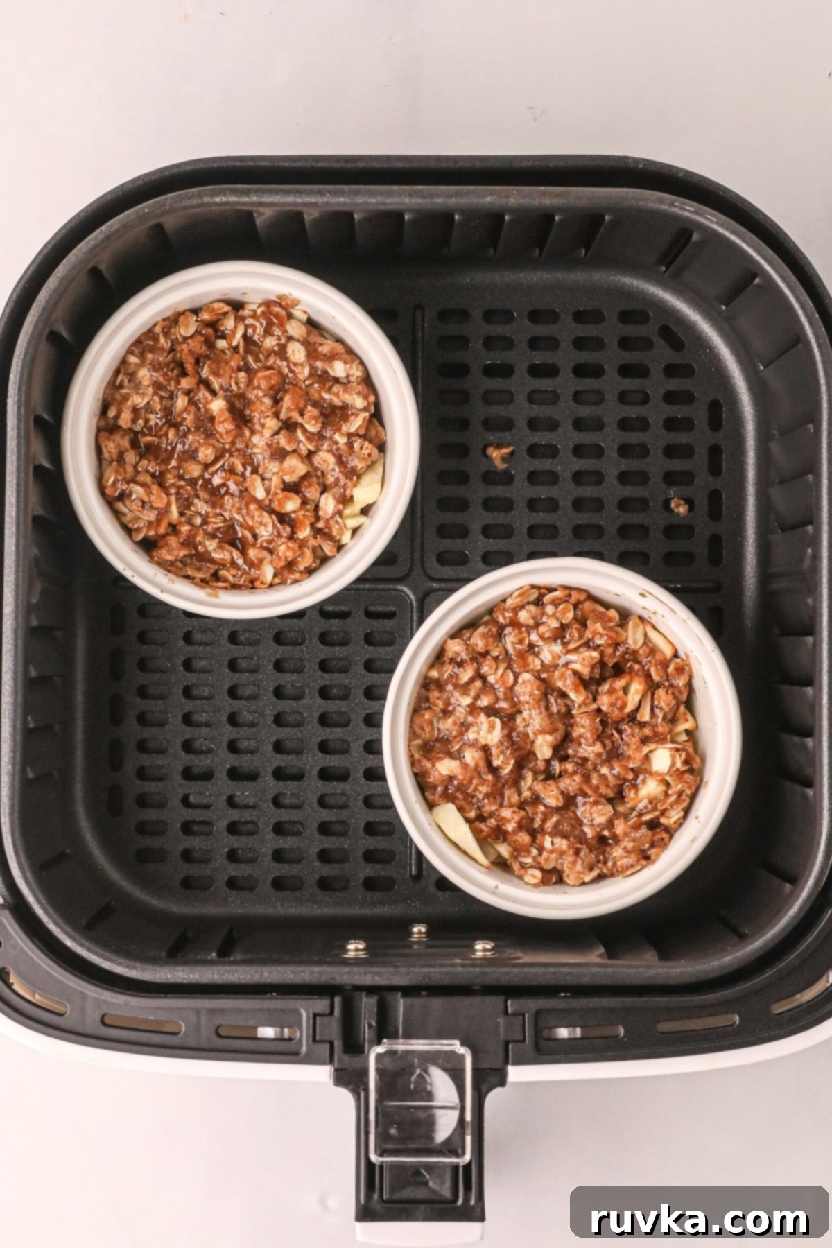 Easy Air Fryer Apple Crisp 7 Apple crisp bowls after being cooked in the air fryer