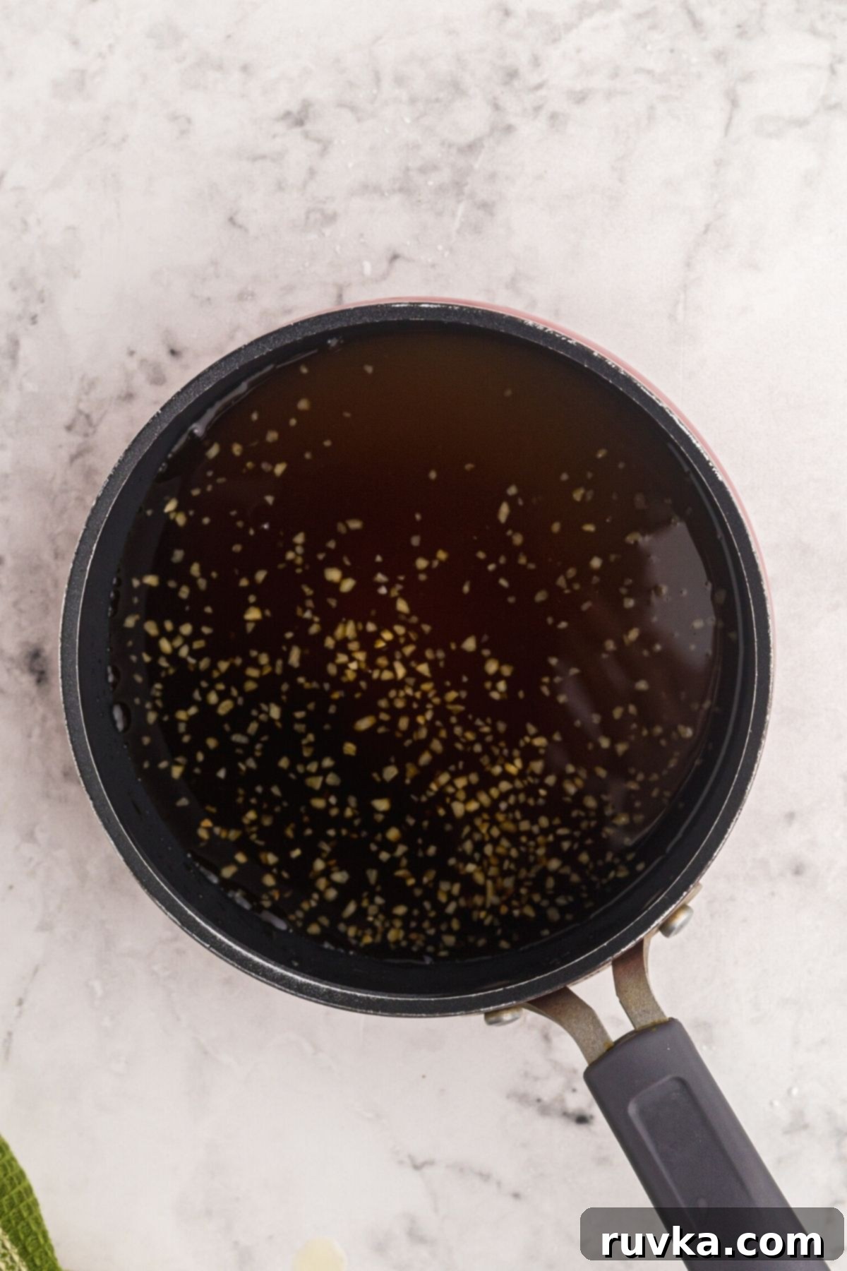 Crispy Air Fryer Sweet & Tangy Chicken 7 Sweet and sour sauce being made in a small saucepan