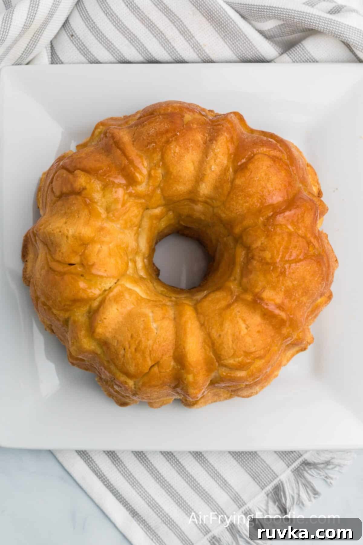 Air-Fried Gooey Cinnamon Pull-Apart 2 Monkey bread fresh out of the air fryer, ready to be topped with a glaze.