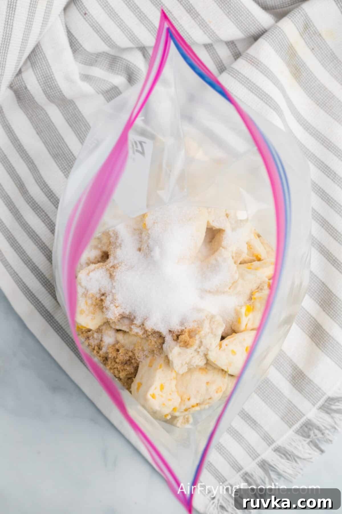 Air-Fried Gooey Cinnamon Pull-Apart 5 resealable plastic bag with biscuit dough, white sugar, and brown sigar, to make air fried monkey bread.