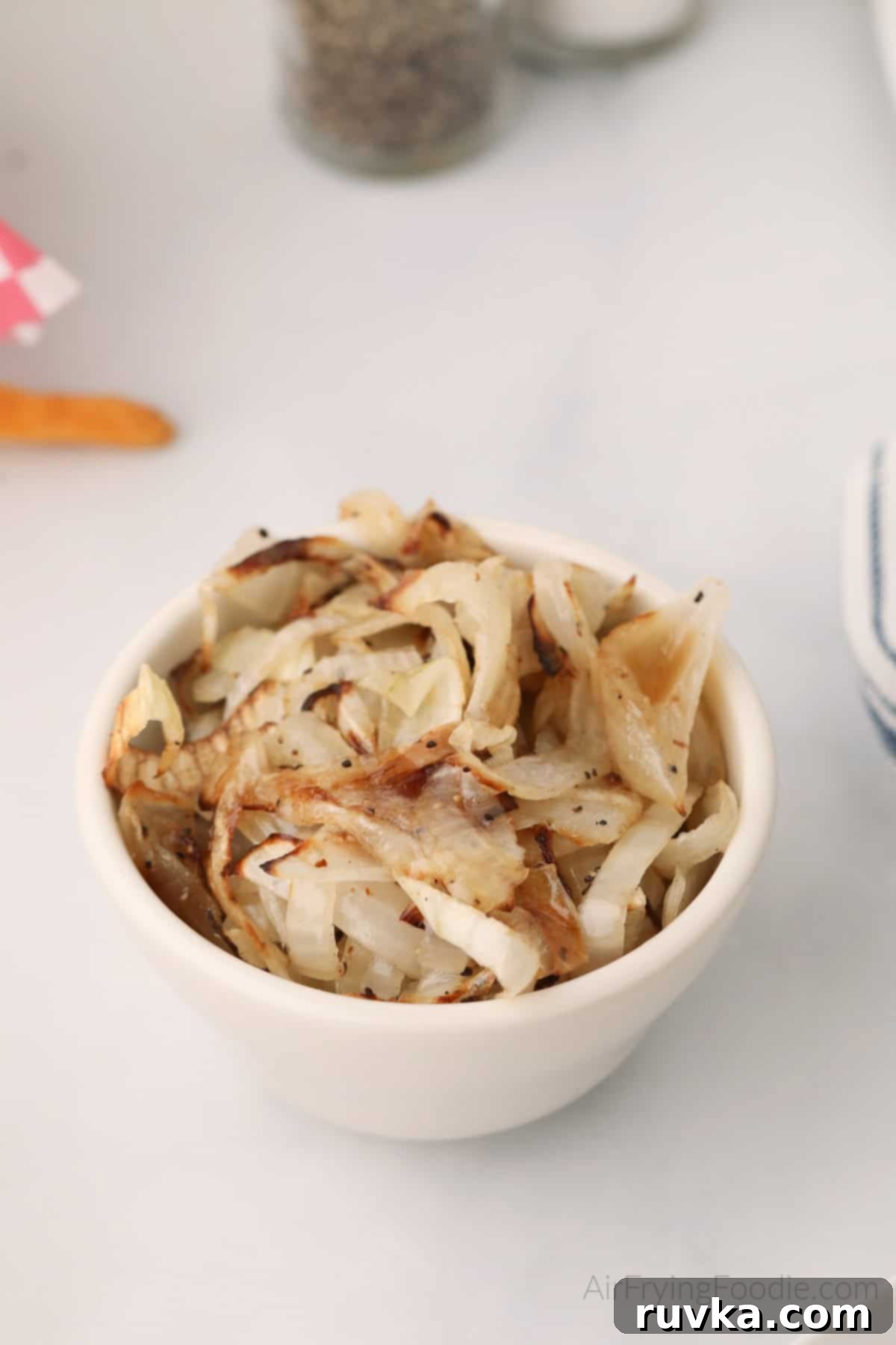Crispy Air-Fried Onions 3 Crispy air fried onions in a bowl, ready to serve.