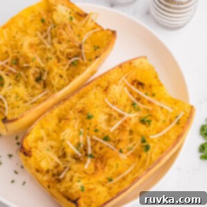 Perfect Air Fryer Spaghetti Squash 13 Overhead of spaghetti squash on a white plate, ready to serve.