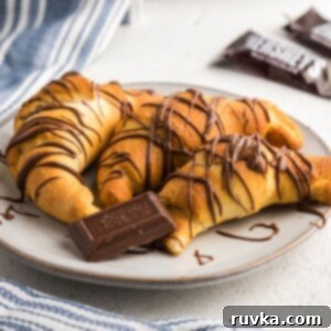 Crispy Air Fryer Chocolate Croissants 8 Golden chocolate drizzled crescent rolls in the shape of croissants