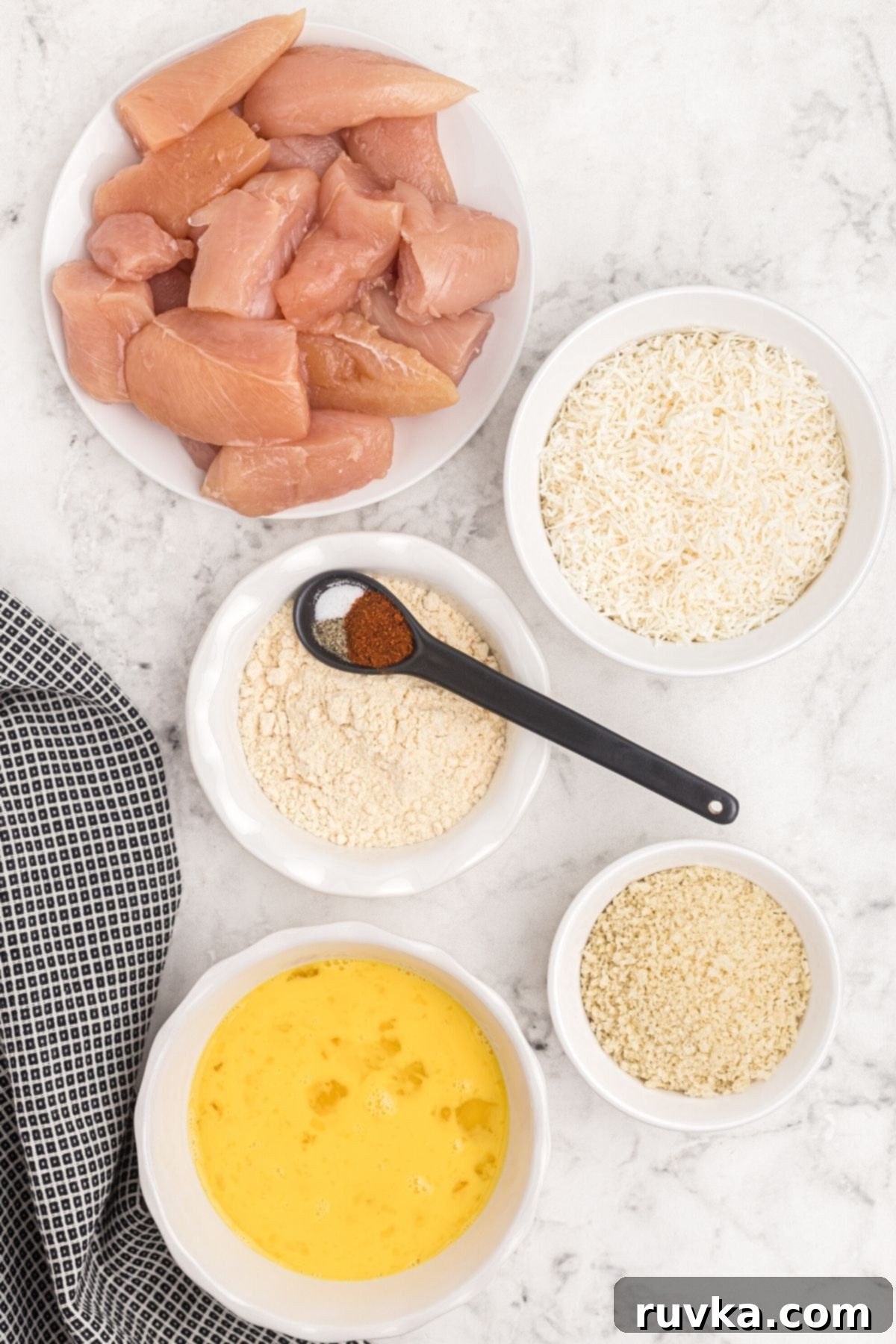 Crispy Air Fryer Coconut Chicken 4 Ingredients needed to make coconut chicken measured on the table.