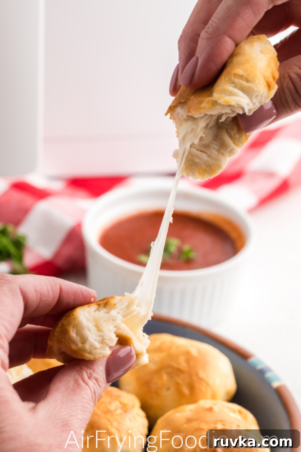 Crispy Air Fryer Mozzarella Balls 7 Mozzarella ball being pulled and ready to eat.