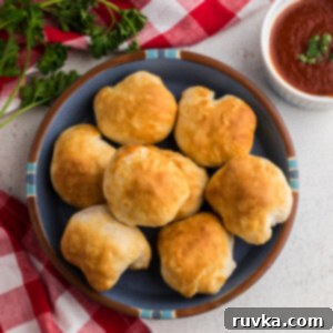 Crispy Air Fryer Mozzarella Balls 8 Air fryer mozzarella balls on a plate ready to serve.