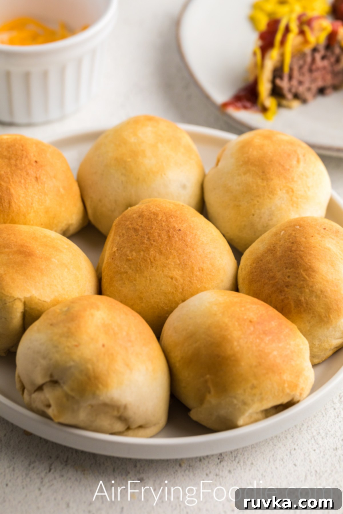 Air Fryer Cheeseburger Poppers 2 Bite sized air fryer cheeseburger bombs are the perfect appetizer for family get togethers or for game days.