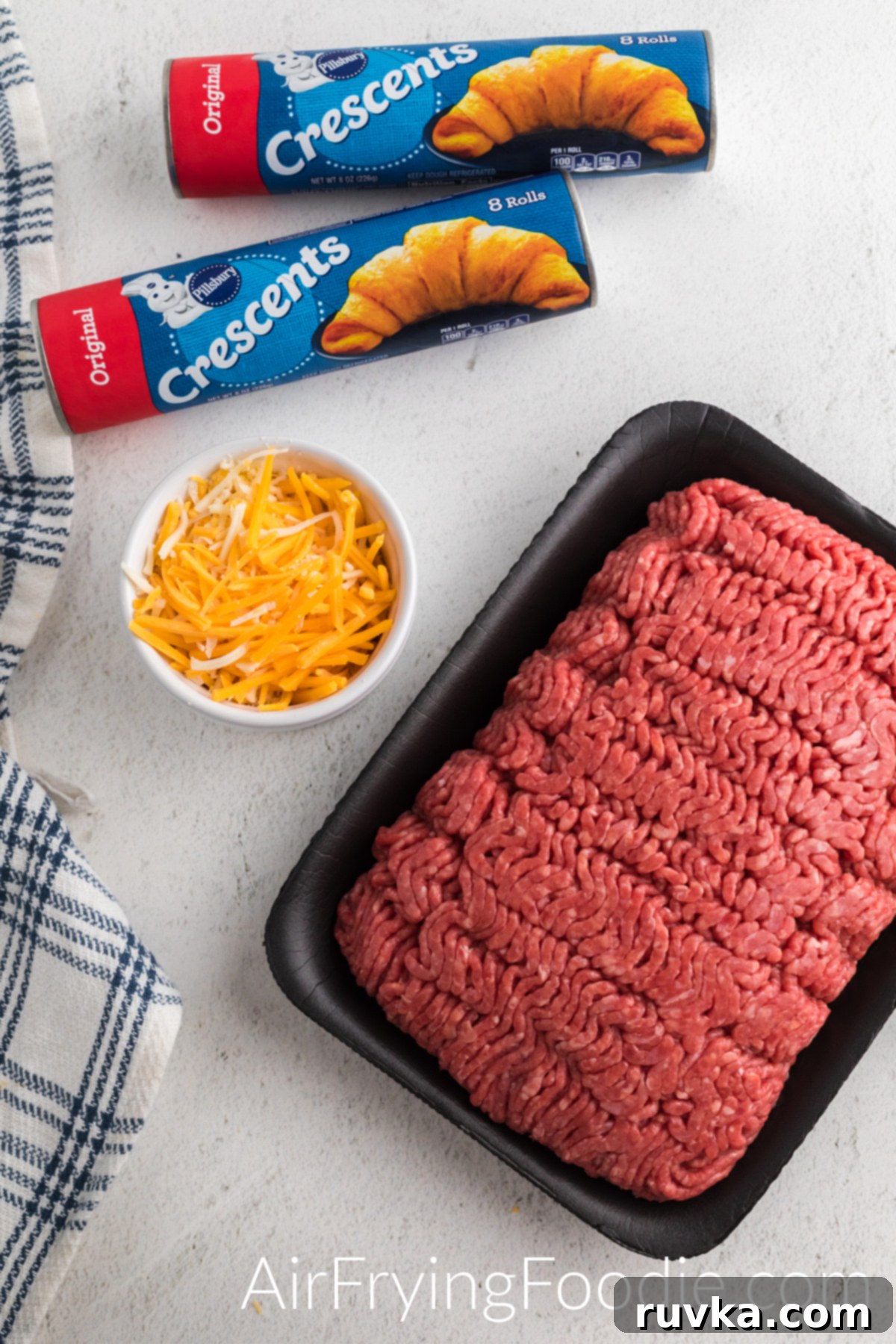 Air Fryer Cheeseburger Poppers 3 Ingredients used to make cheeseburger bombs in the air fryer.