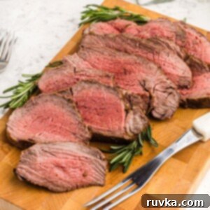Effortless Easter with Your Air Fryer 10 Juicy cuts of tenderloin on a cutting board in front of an air fryer