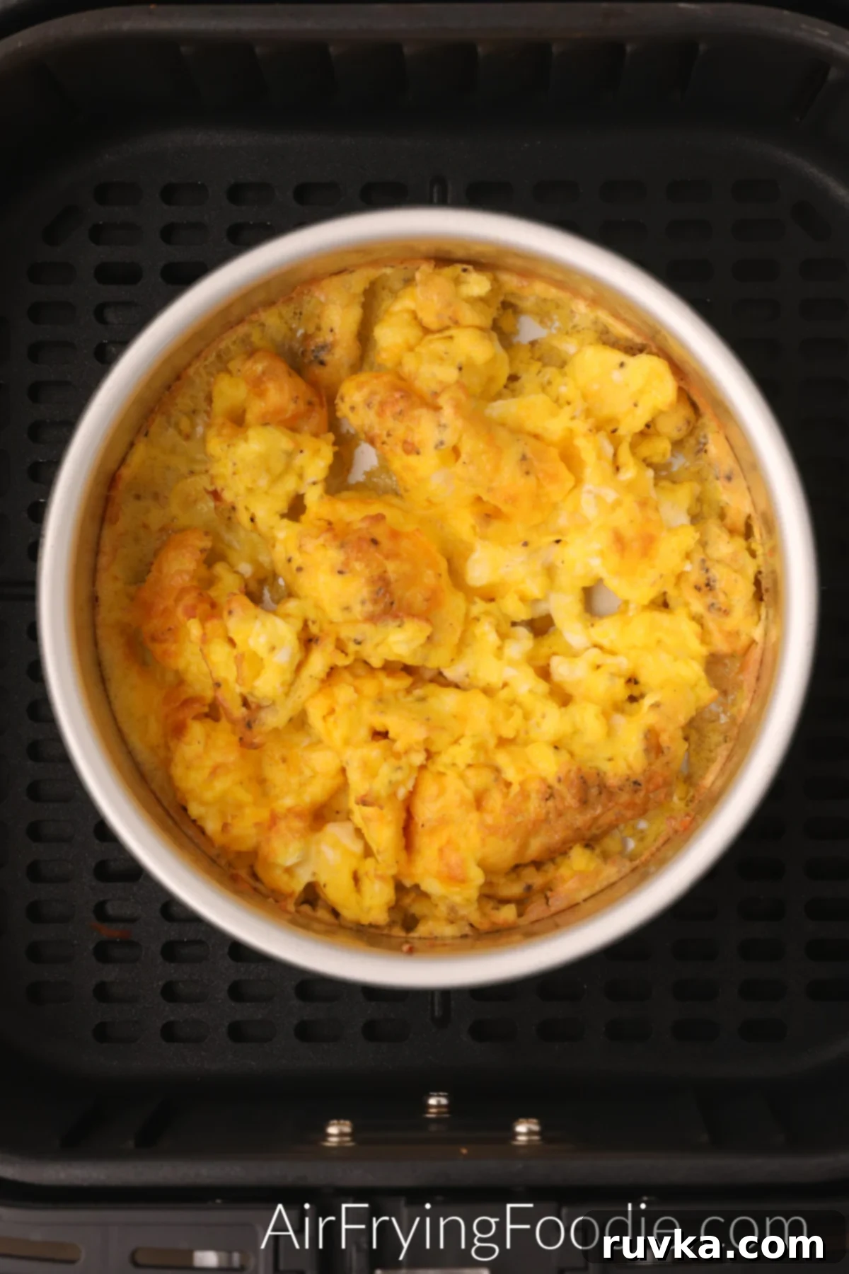 Fluffy Air Fryer Scrambled Eggs 6 Air Fryer Scrambled Eggs in the air fryer basket.