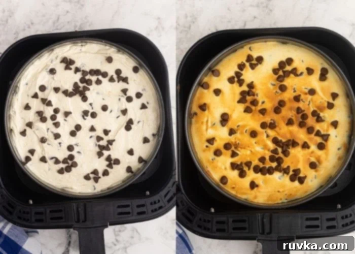 Chocolate Chip Cookie Cheesecake in the Air Fryer 4 Cheesecake filling poured over the baked cookie dough crust in a springform pan, topped with extra chocolate chips, ready for air frying.