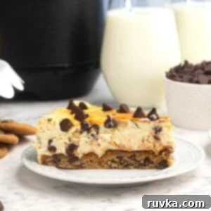 Chocolate Chip Cookie Cheesecake in the Air Fryer 7 Chocolate chip cheesecake cut into a slice on a white plate