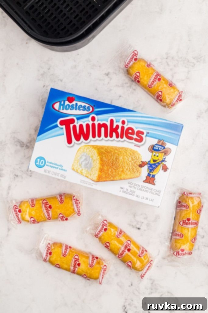 Warm Golden Air Fryer Twinkies 4 An open box of golden Twinkies, ready to be prepared, resting on a clean marble countertop.
