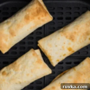 Air Fryer Fiesta Mexican Delights 13 Crispy frozen burritos cooked in an air fryer basket.