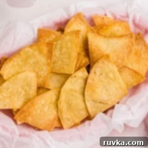 Air Fryer Fiesta Mexican Delights 8 Golden crispy tortilla chips stacked in a basket.