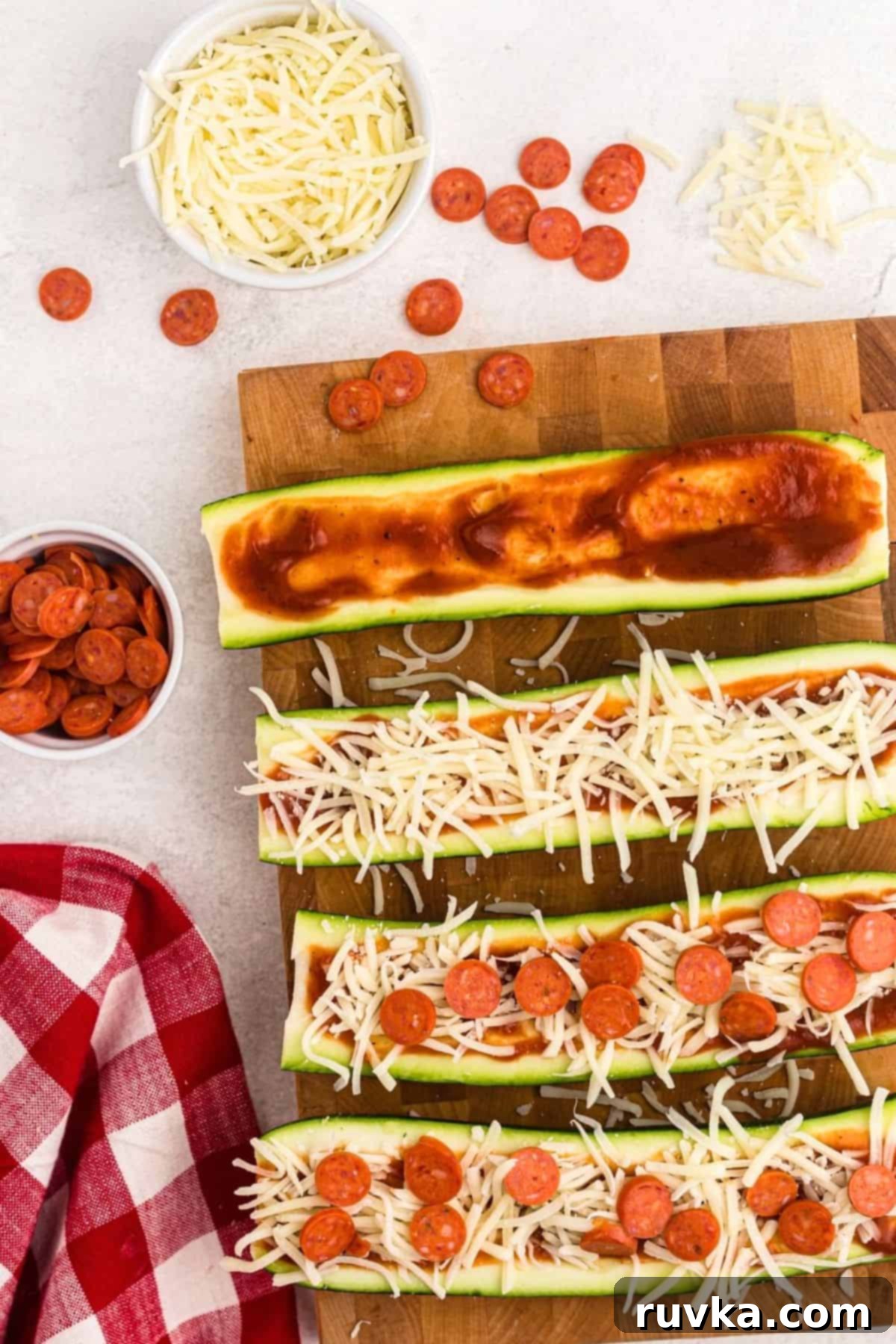 Quick & Easy Air Fryer Zucchini Pizza Boats 5 Zucchini cut in half and filled with pizza sauce, cheese, and topped with pepperoni.