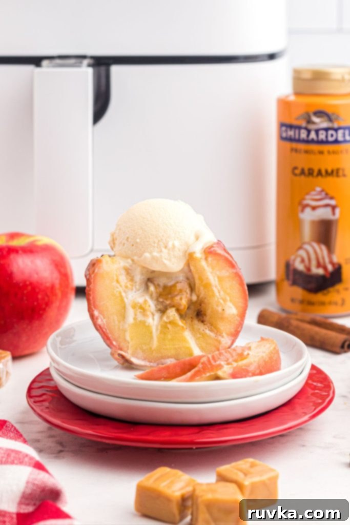 Air Fryer Blooming Apple Bliss 12 A delicious air-fried blooming apple, sliced and overflowing with melted caramel, elegantly topped with a scoop of creamy vanilla ice cream.