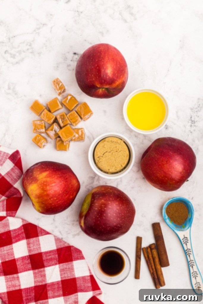 Air Fryer Blooming Apple Bliss 4 All the necessary ingredients, including apples, caramel squares, butter, brown sugar, ground cinnamon, and vanilla, neatly measured out on a white marble table.