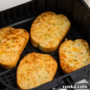 Crispy Air Fryer Texas Toast 8 Cheesy Texas Toast, made perfectly golden in the air fryer, ready to be enjoyed.