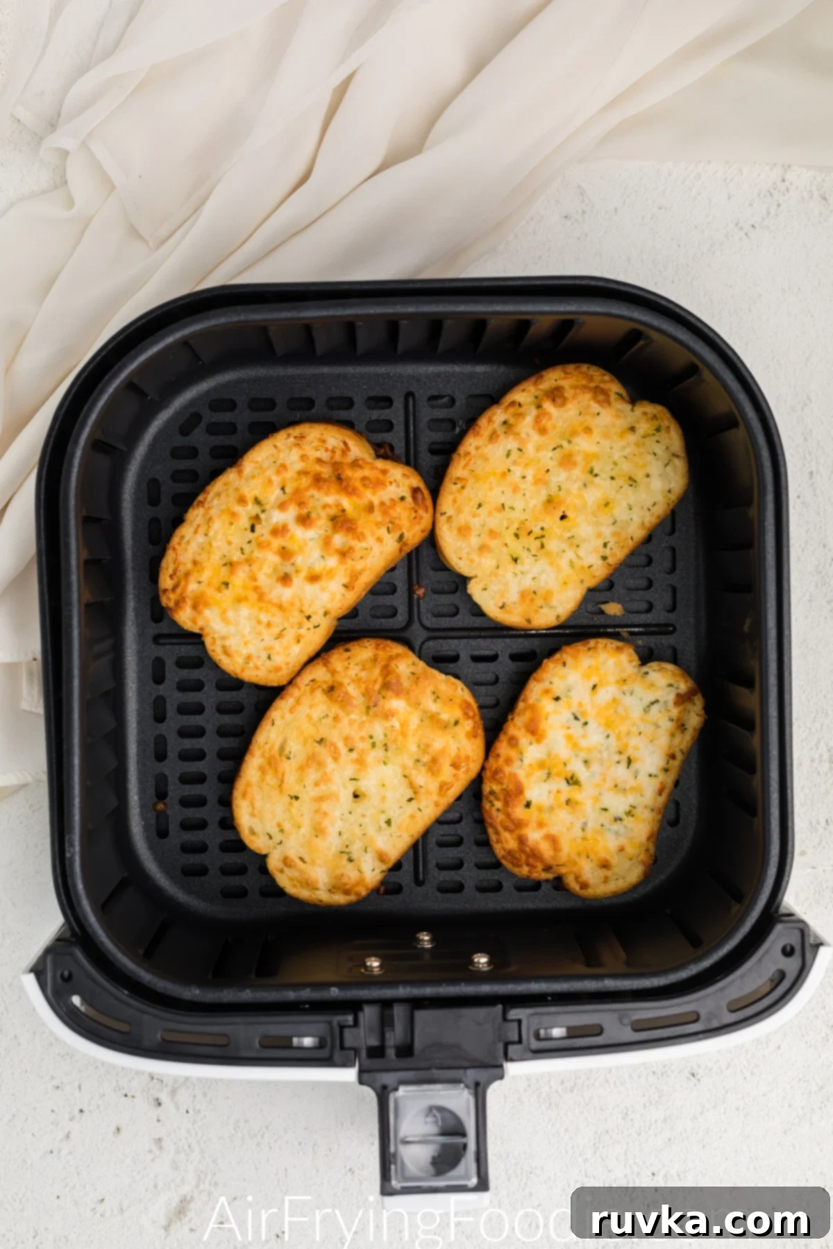 Crispy Air Fryer Texas Toast 5 Perfectly golden brown Texas Toast slices, hot and ready to serve, displayed in the air fryer basket.