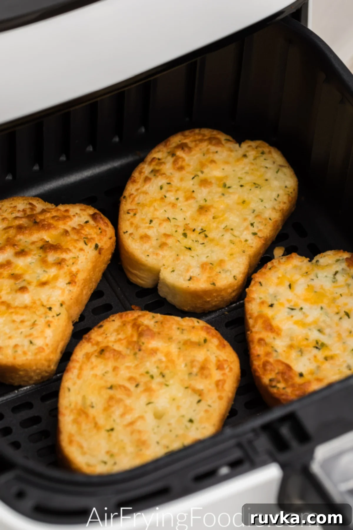 Crispy Air Fryer Texas Toast 6 Cheesy Texas Toast, golden brown and glistening, served directly from the air fryer basket.