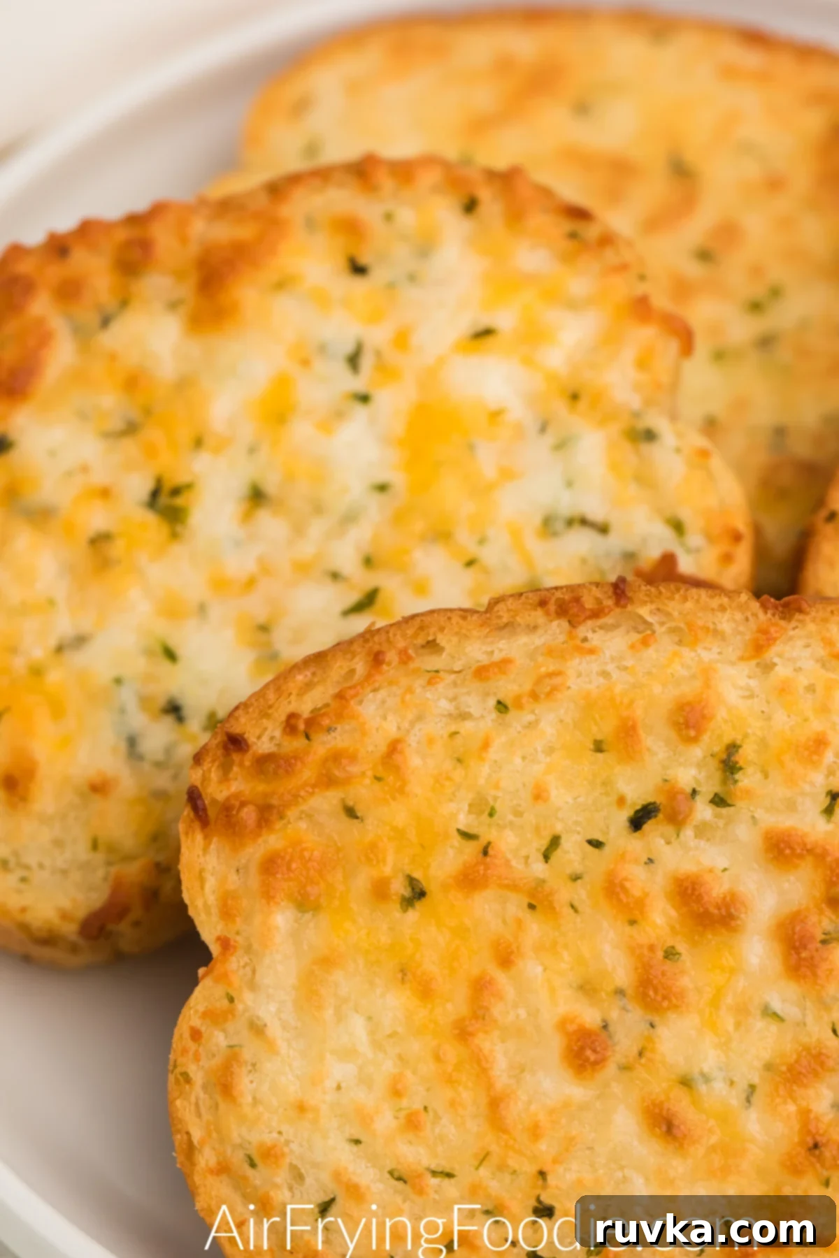Crispy Air Fryer Texas Toast 7 Perfectly golden brown cheesy Texas Toast, fresh out of the air fryer, promising crunchy perfection.