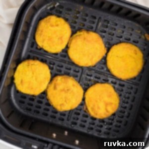 Crispy Air Fryer Fried Green Tomatoes 11 Overhead photo of air fried green tomatoes in the air fryer basket