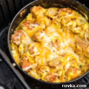 Easy Air Fryer Breakfasts 3 A fully cooked, savory Air Fryer Breakfast Bowl with eggs, sausage, and vegetables, ready to enjoy.