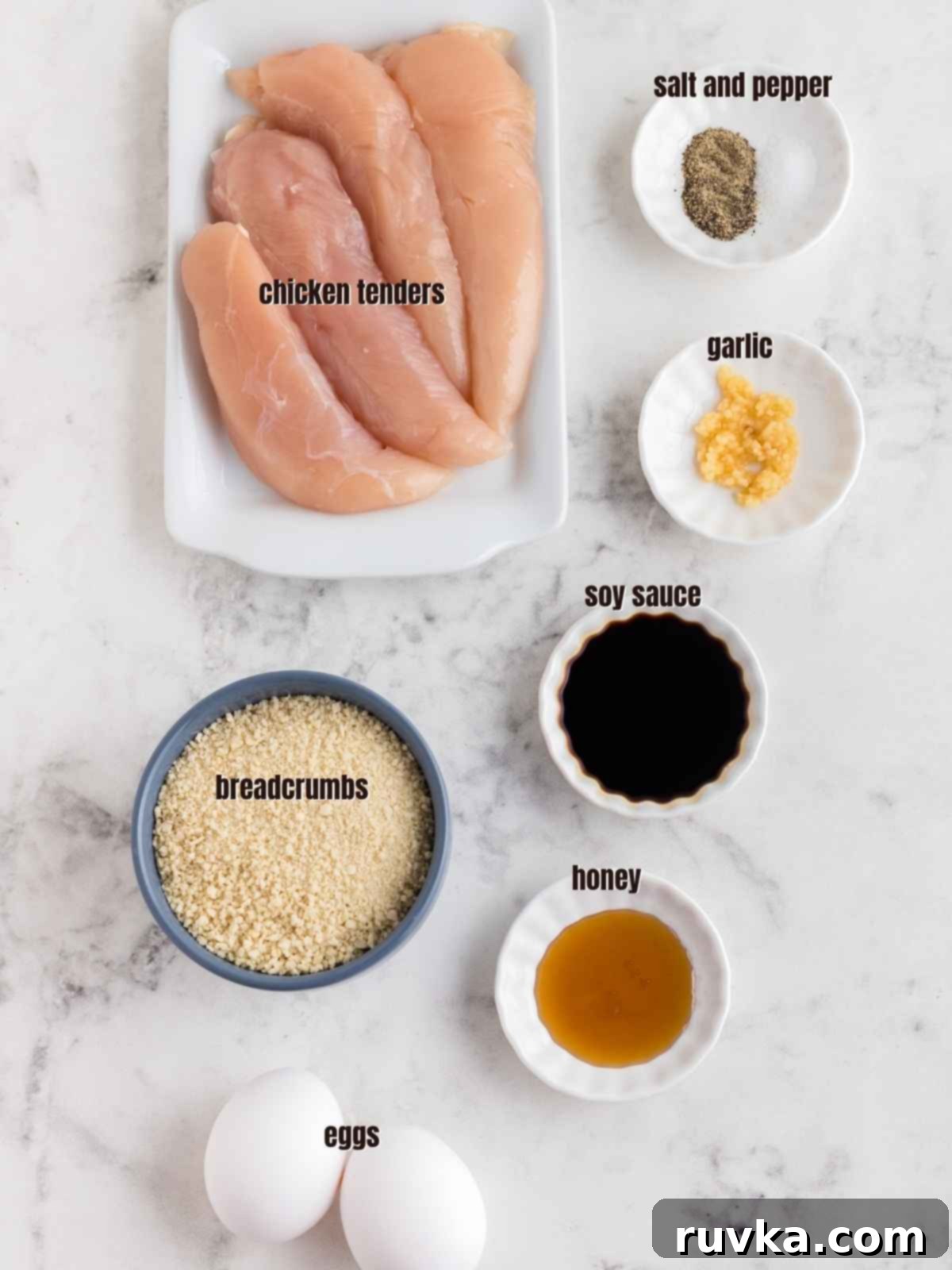 Crispy Air Fried Honey Garlic Chicken Strips 4 Various ingredients laid out for Honey Garlic Chicken Tenders: chicken, honey, soy sauce, garlic, eggs, Panko breadcrumbs, salt, and pepper.