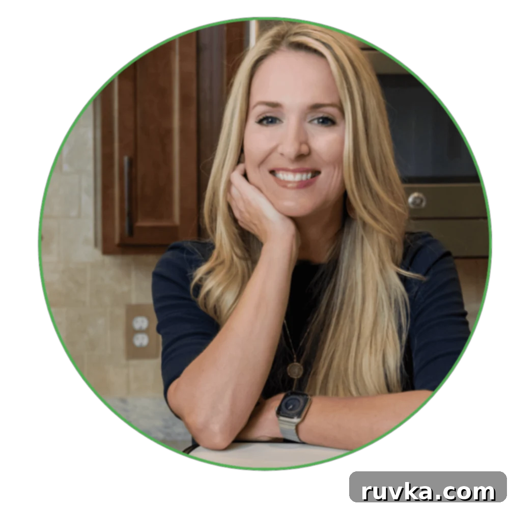 A smiling woman, Jen Gamble, recommending the Air Fryer Teriyaki Salmon Bites recipe as a quick and easy meal.
